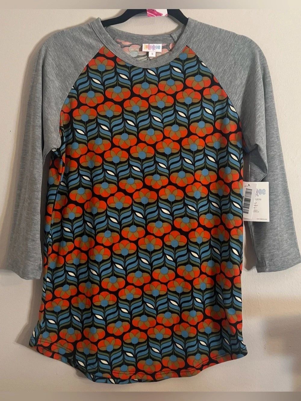 LuLaRoe Grey Raglan Top with Orange and Teal Floral Geometric Print